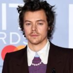 English singer and actor Harry Styles sparks intrigue among fans as he reveals a mysterious 'Olivia' tattoo on his thigh during a fun-filled boat outing in Italy.