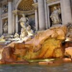 A viral video captures a tourist defying respect by climbing into Rome's iconic Trevi Fountain to fill her water bottle, sparking outrage and discussions about monument preservation.