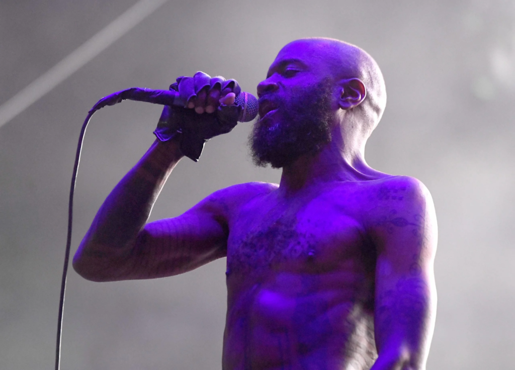 Death Grips ends their Fayetteville performance due to continuous glow stick throwing by fans, revealing the challenges of post-pandemic concerts.