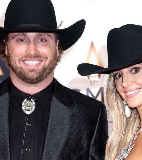 "Former NFL player Devlin Hodges supports Lainey Wilson at the 2023 CMA Awards, showcasing their love and her dominance as the most-nominated artist of the night."