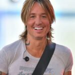 "In a spectacular finale, Keith Urban graces The Voice Season 24 stage with a mesmerizing performance of his 2016 hit, 'Blue Ain't Your Color.' Relive the magic and fan reactions as the country star brings nostalgia to the grand finale."