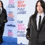 "Grammy-winner Billie Eilish steals the spotlight in Valentino's boxy office wear at the Independent Spirit Awards 2024. A daring departure from tradition, Eilish's red carpet look challenges norms and defines a new era in celebrity fashion."