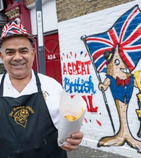 London's renowned Golden Chippy is ordered to take down its Union flag mural, sparking debates over patriotism and cultural representation.