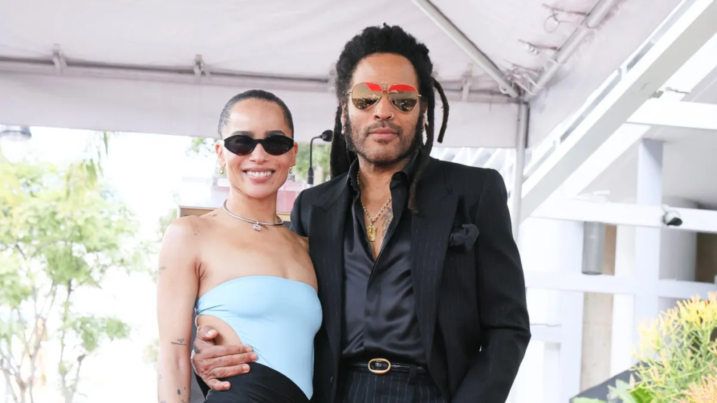 Join the heartwarming moment as Zoë Kravitz brings laughter to her father Lenny Kravitz's Walk of Fame induction, playfully teasing his iconic fashion choices.

