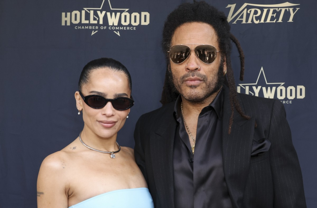 Join the heartwarming moment as Zoë Kravitz brings laughter to her father Lenny Kravitz's Walk of Fame induction, playfully teasing his iconic fashion choices.

