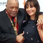 In a revealing interview, Rashida Jones discusses 2Pac's controversial remarks about her iconic father, Quincy Jones, shedding light on their complex relationship and setting the record straight.