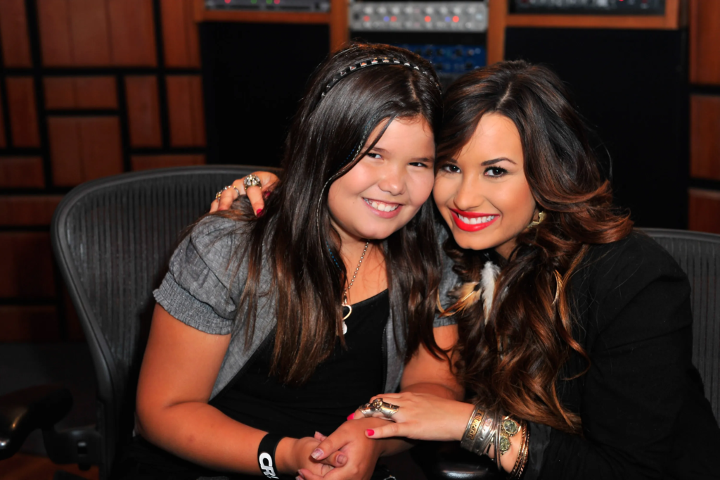 "Madison De La Garza, known for her role as a child actress and sister to singer Demi Lovato, has announced her exciting pregnancy news. Find out more about this joyful update and the family's reactions."
