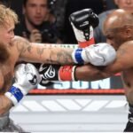 In a highly anticipated boxing clash, Jake Paul defeats Mike Tyson by decision. The match, filled with intensity, ended with Paul’s hand raised in victory. Find out more about the thrilling outcome and what this means for both fighters.