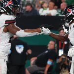 Joe Mixon delivered an electrifying performance with three touchdowns, while the Texans' offensive line embraced the challenge, paving the way for a significant win.