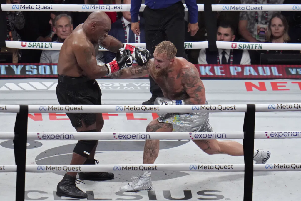 In a highly anticipated boxing clash, Jake Paul defeats Mike Tyson by decision. The match, filled with intensity, ended with Paul’s hand raised in victory. Find out more about the thrilling outcome and what this means for both fighters.
